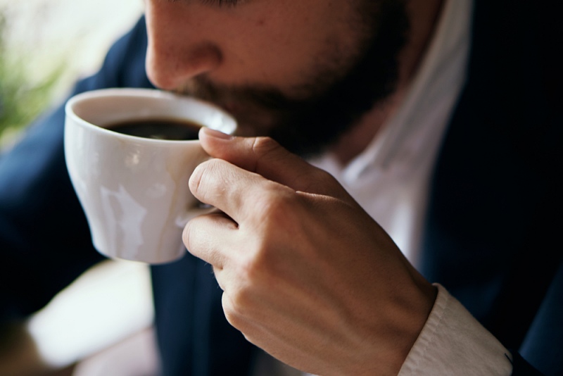 business man drinking coffee cafe | Benefits of drinking coffee