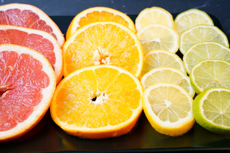 citrus-fruit-sliced-arranged-on-black citrus for cancer SS