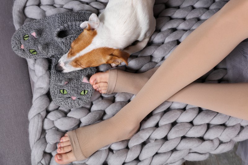 Cozy Day at Home Dog Sleeping on Female Feet | Senior Gift