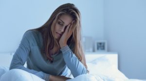 Depressed Woman Awake at Night | Low Iodine Symptoms | Featured