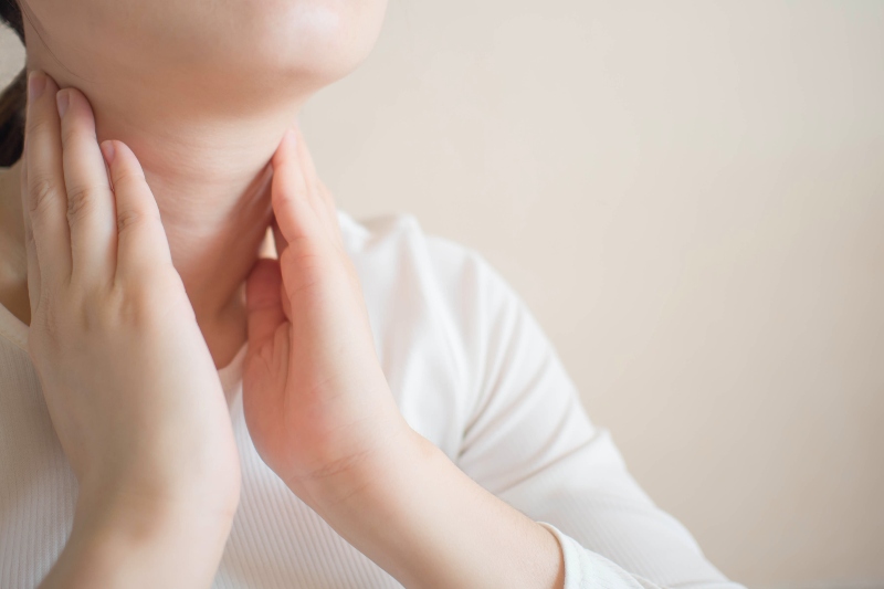 Female Checking Thyroid Gland | Low Iodine Symptoms