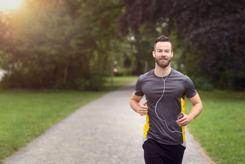 Fit Bearded Young Man Jogging through a Park | How to Fix Hormonal Imbalance