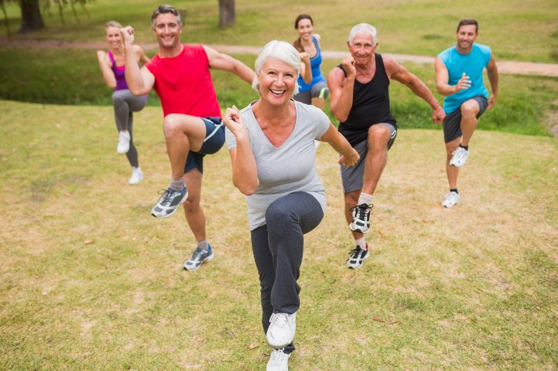 Happy Athletic Group Training on a Sunny Day | Standing Core Exercises for Seniors