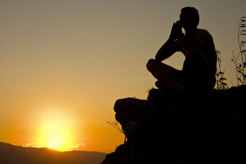 man-sitting-on-top-stone-meditating Staying Mentally Sharp