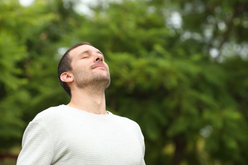 relaxed adult man breathing fresh air |