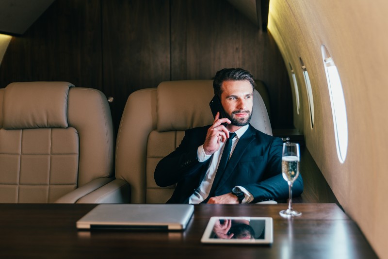 Businessman flying on his private jet-Daily Habits of Multi-Billionaires