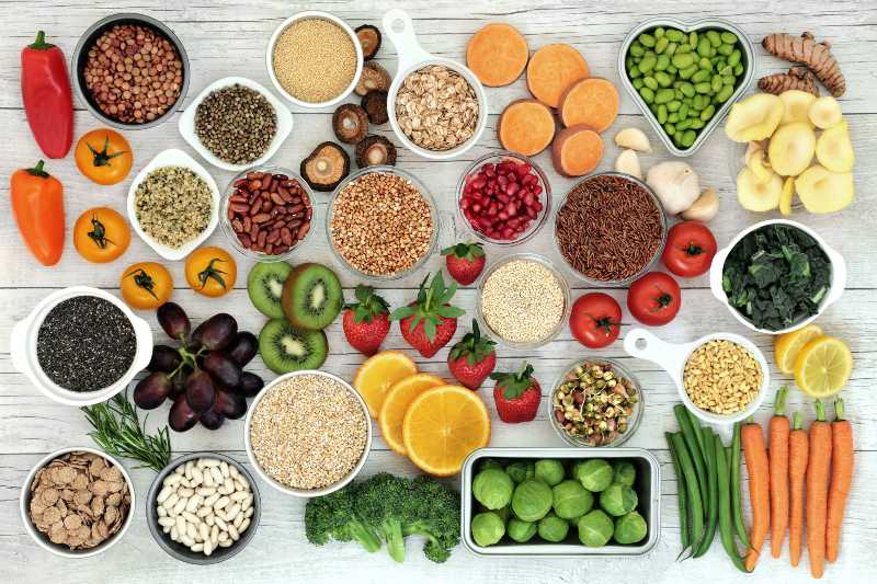 Fresh super food concept with fruit, vegetables, grains, cereals, pulses, seeds, herbs and spice-daniel fast