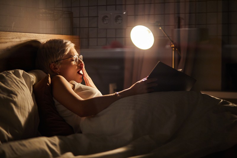 Tired Bored Woman Reading Novel Before Going to Bed-Falling Asleep