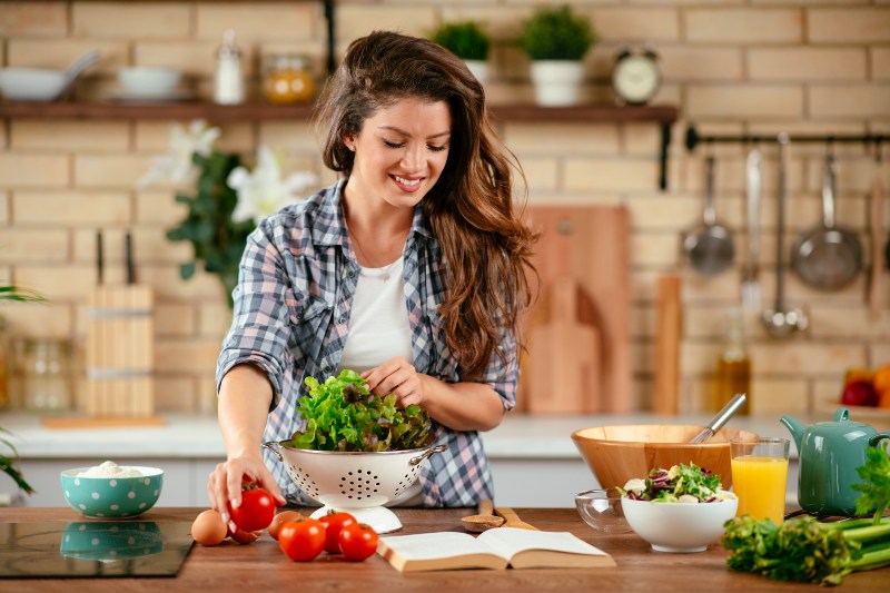 Beautiful Young Woman is Preparing Vegetable Salad | HCG Diet Protocol