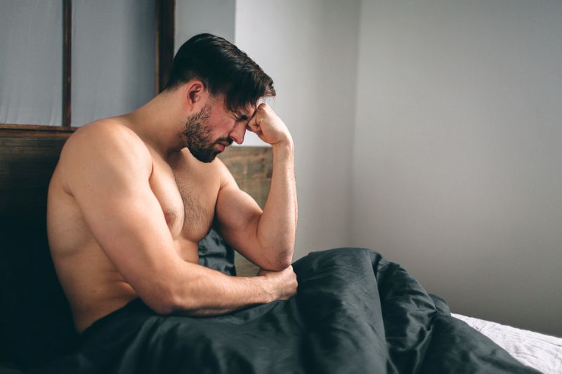 depressed-man-sitting-on-bed-empty Erectile Dysfunction SS