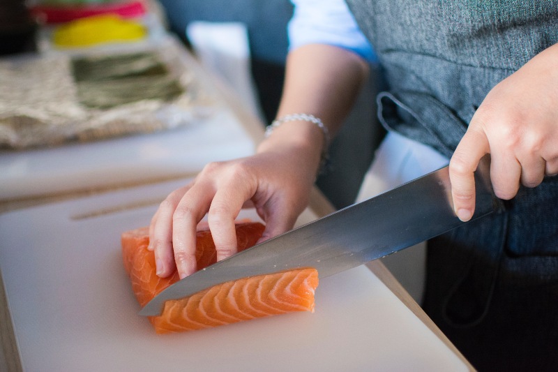 Person Slicing Meat on White Chopping Board | Tuna vs Salmon