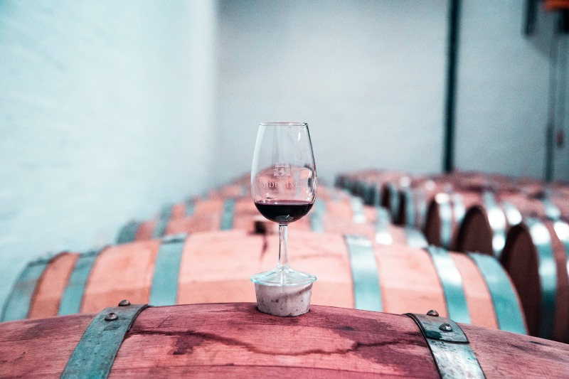 Photo of Wine Glass on Top of Barrel | Red vs White Wine
