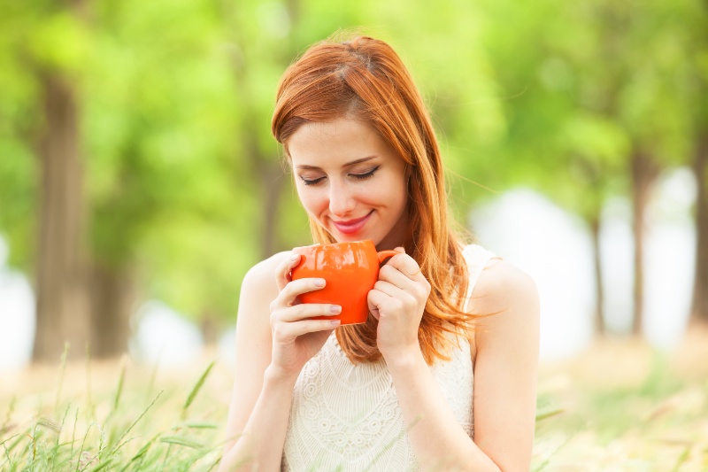 Redhead Girl with Orange Cup at Outdoor | Sencha Green Tea
