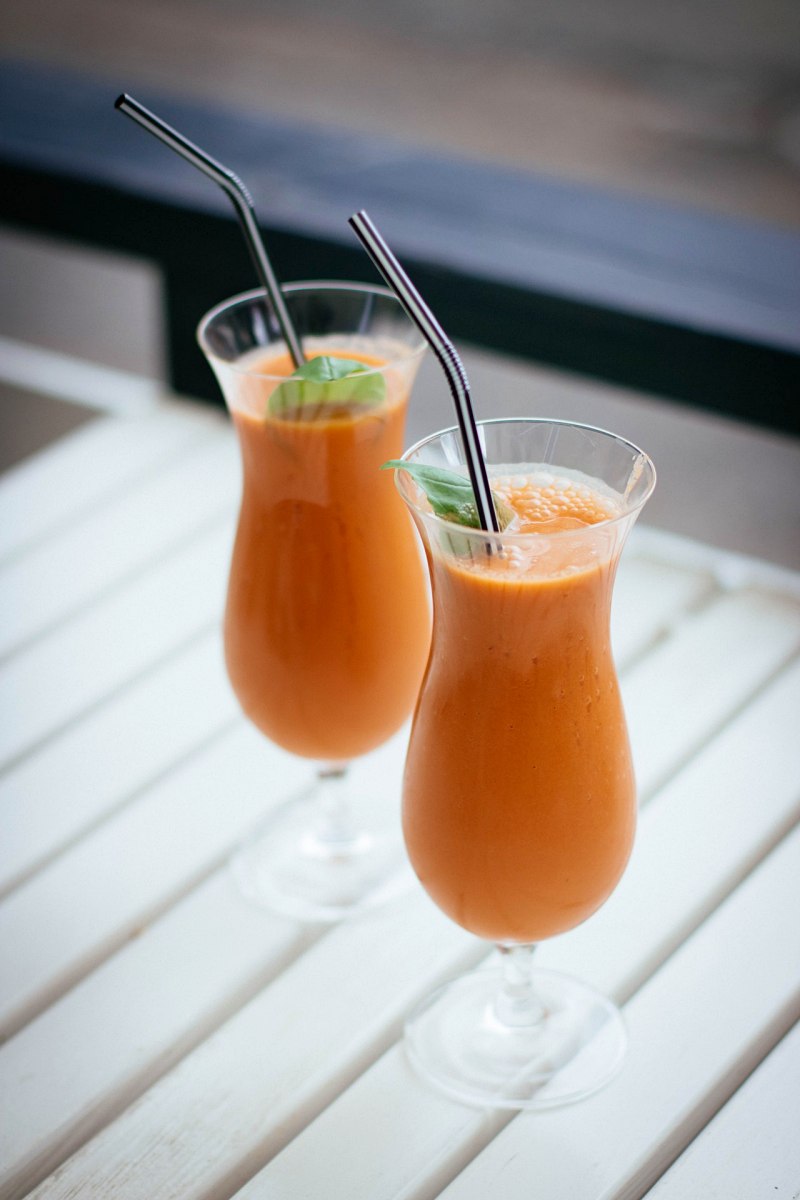 selective focus photography of two orange drinks | lifestyle juice 