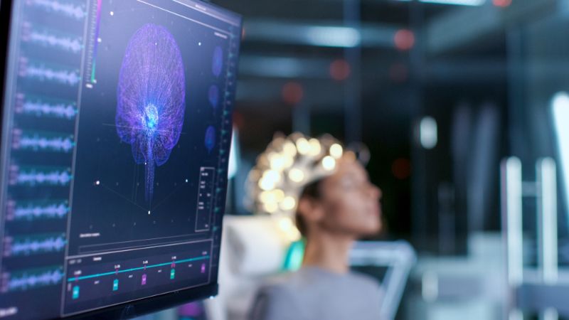 woman-wearing-brainwave-scanning-headset-sits The Science of Sleep SS
