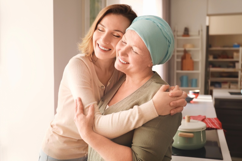 Young Woman Visiting Her Mother with Cancer Indoors | Sencha Green Tea