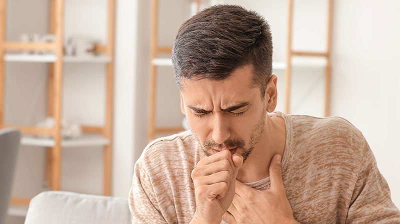 Coughing young Man Home | How to Clean Your Lungs to Remove Stale Air