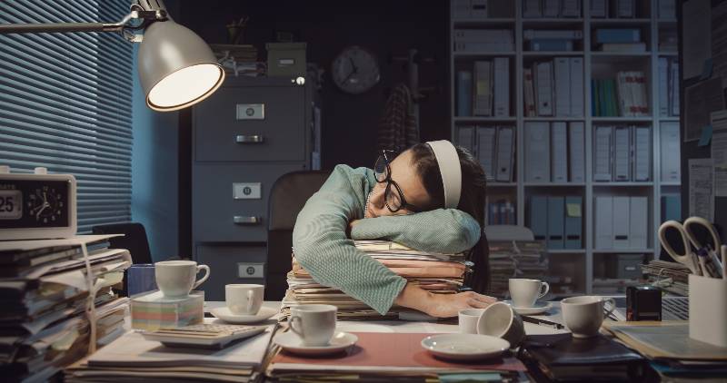 Exhausted office worker falling asleep in the office late at night | Can't Sleep At Night