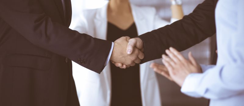 unknown-businesspeople-shaking-their-hands-after Success at Work SS