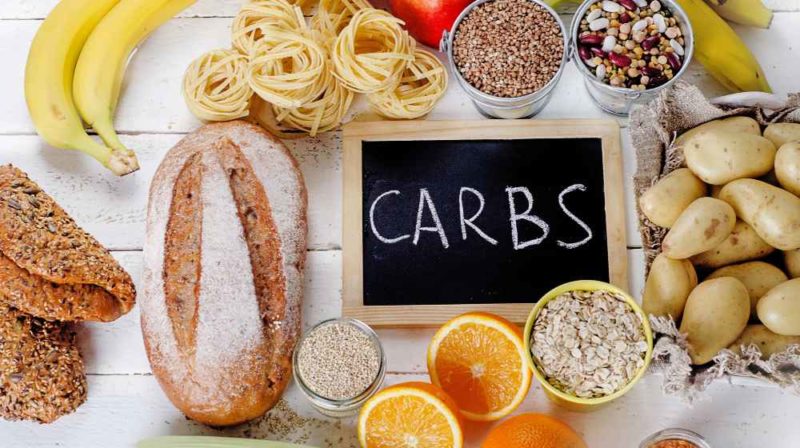 Best Sources of Carbs on a white wooden background | Do Carbs Make You Fat