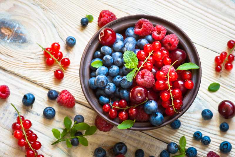 Fresh berries. Various summer berries in a bowl | Can Expired Food Kill You