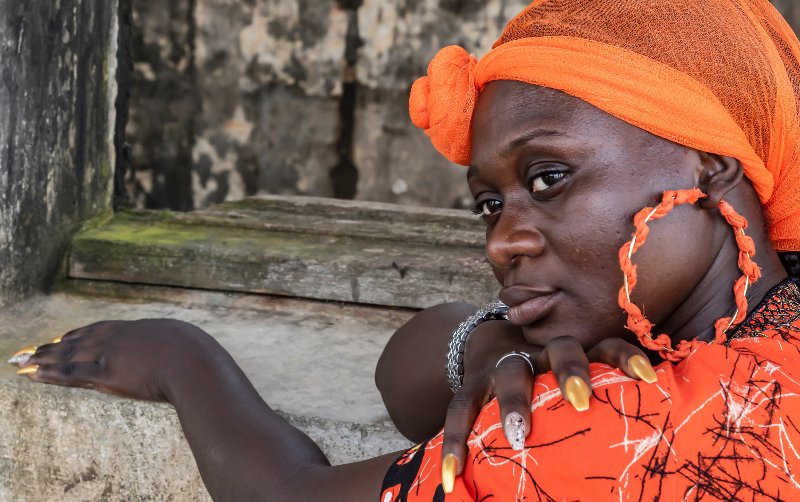 African Woman from Ghana with Orange Headdress | Lupus Pernio