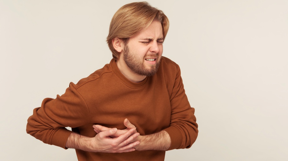 Cardiac Health Problems Portrait of Bearded Man in Sweatshirt | Stroke vs Heart Attack | Featured