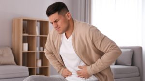 Man Suffering from Stomach Ache at Home | Stomach Problems That Affect the Heart | Featured