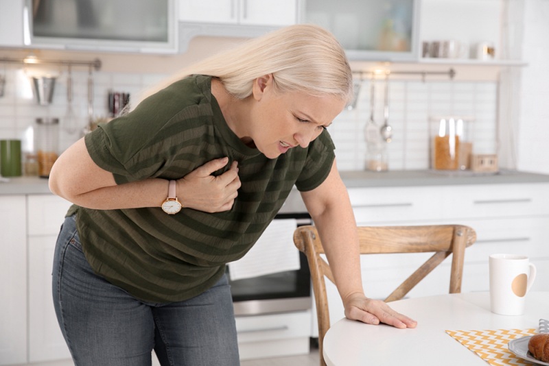 mature woman having heart attack kitchen | heart attack