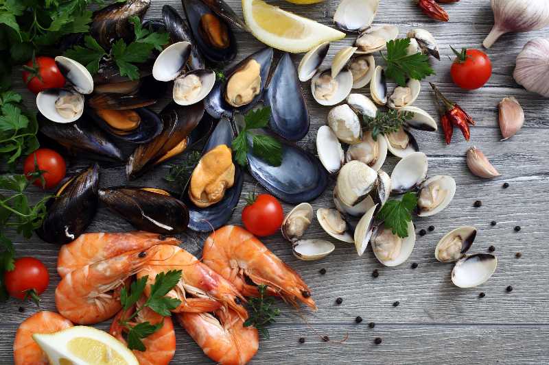 top view fresh seafood clams,mussels and prawns | Can Expired Food Kill You