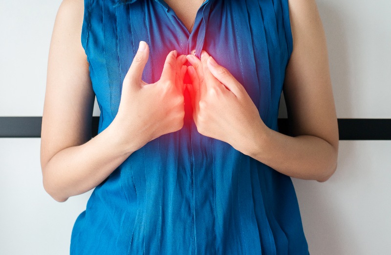Woman Having Symptomatic Acid Reflux | Stomach Problems That Affect the Heart