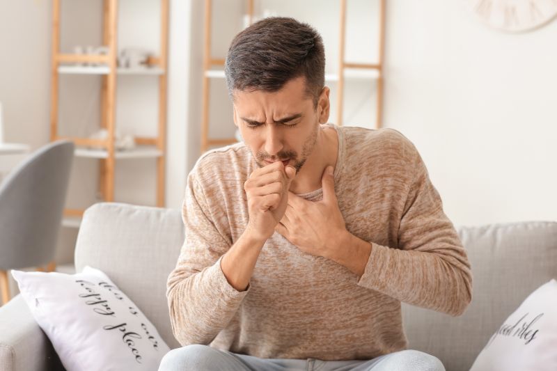 Coughing young man home | COPD and heart failure