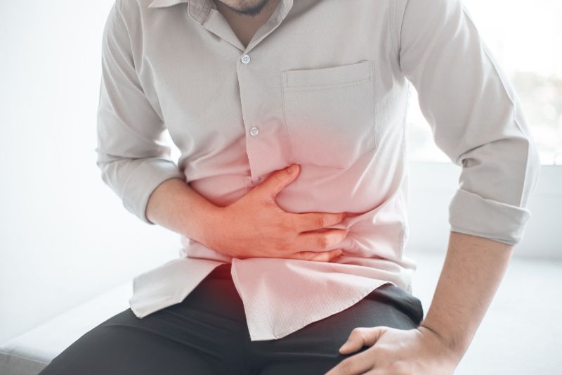 Man abdominal pain abdominal disease concept | Prostate artery embolization