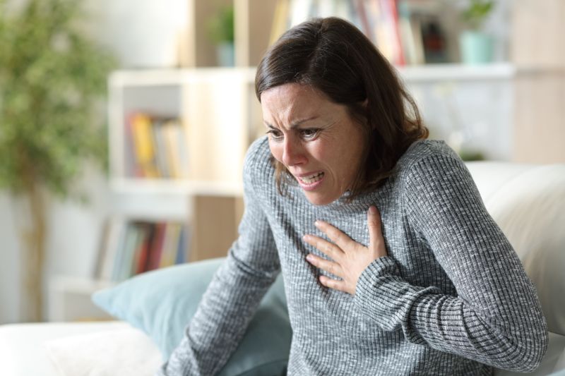 Scared adult woman suffering heart attack | COPD and heart failure