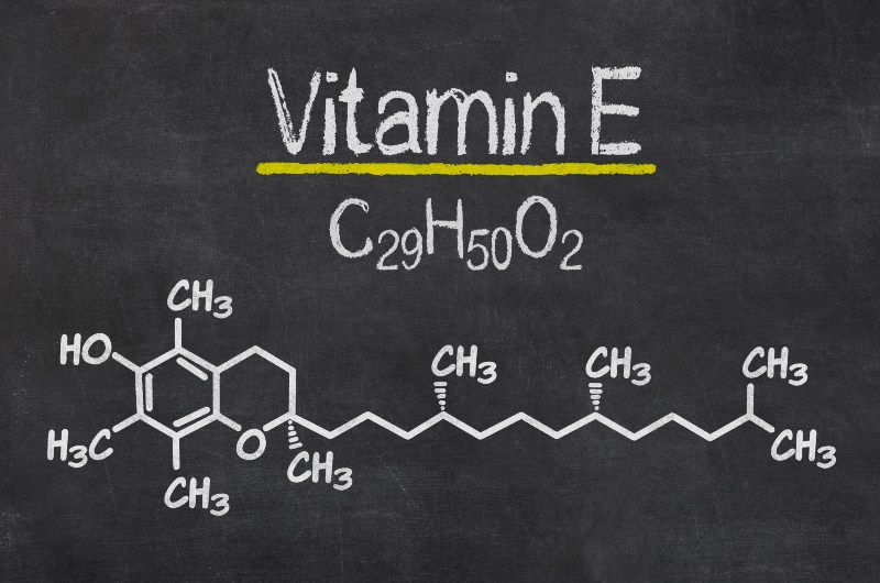 Blackboard with the Chemical Formula of Vitamin E | How Is Vitamin E Thought to Play a Role in Reducing the Risk of Heart Disease