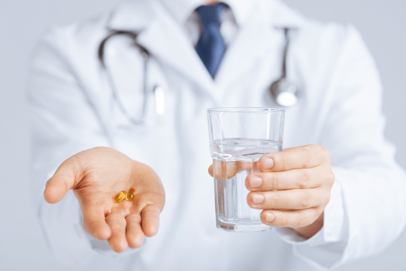 picture doctor hands giving capsule glass | omega-3 benefits