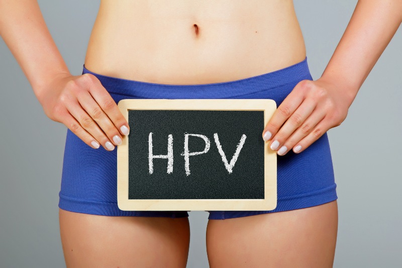 Women's Health Concept Young Woman Holds a Small Chalkboard with HPV Inscription | How to Build Your Immune System to Fight HPV