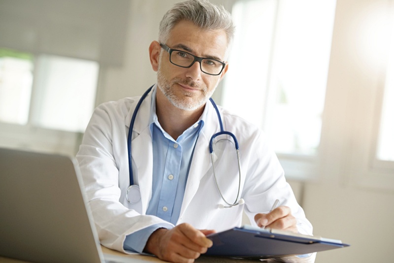 doctor office working on patient file | erectile dysfunction exercises