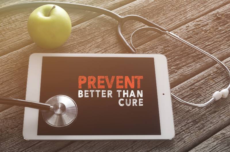 Fresh green apple and stethoscope with word PREVENT BETTER THAN CURE | Jessica Viker: Why Prevention is Better Than a Cure