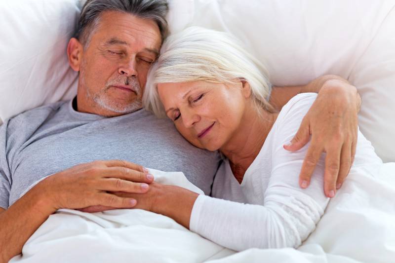 Senior couple sleeping in bed | How to Optimize Your Sleep, Practical Advice From an Ex-Insomniac